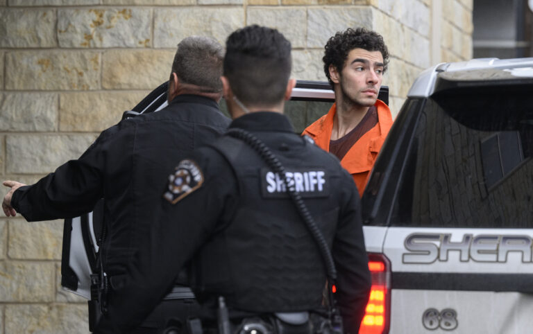 Suspected shooter Luigi Mangione is led into the Blair County Courthouse for an extradition hearing December 10, 2024 in Hollidaysburg, Pennsylvania.